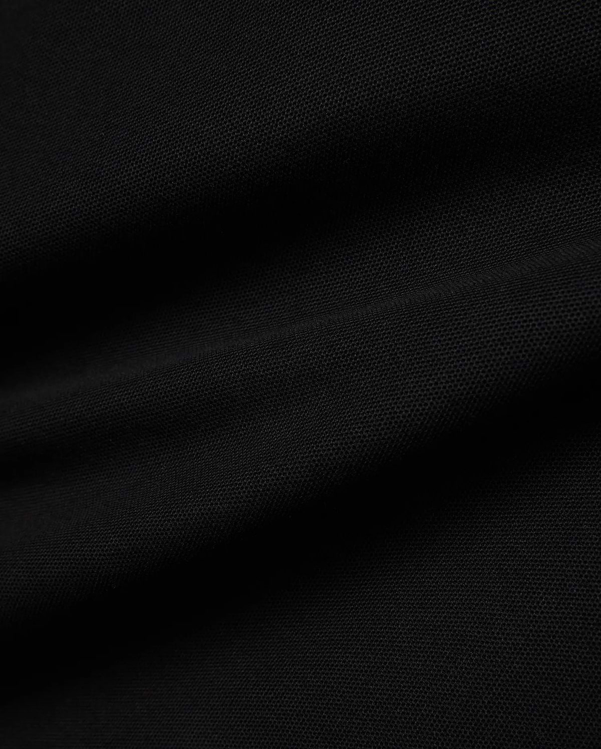 Kids Jaydon Pique Polo in deep black, showcasing its premium textured pique fabric, designed for a classic fit, and featuring the signature small embroidered Psycho Bunny skull logo on the left chest.