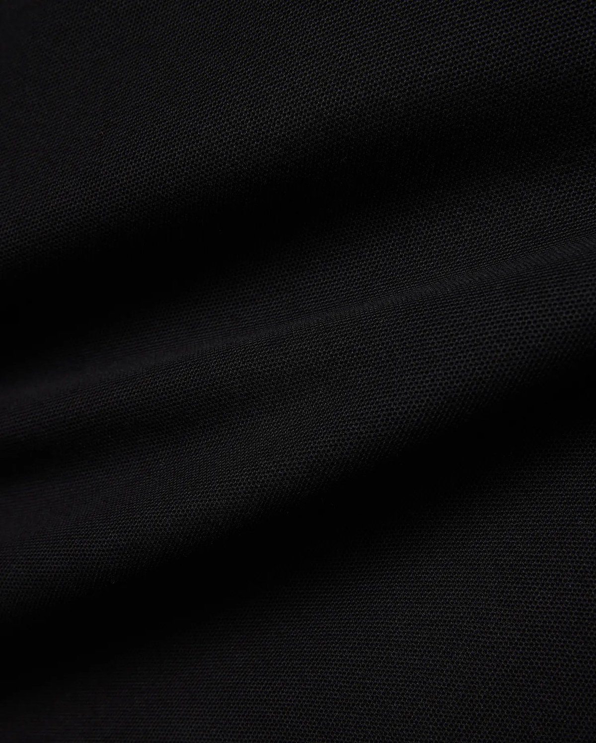 Kids Jaydon Pique Polo in deep black, showcasing its premium textured pique fabric, designed for a classic fit, and featuring the signature small embroidered Psycho Bunny skull logo on the left chest.