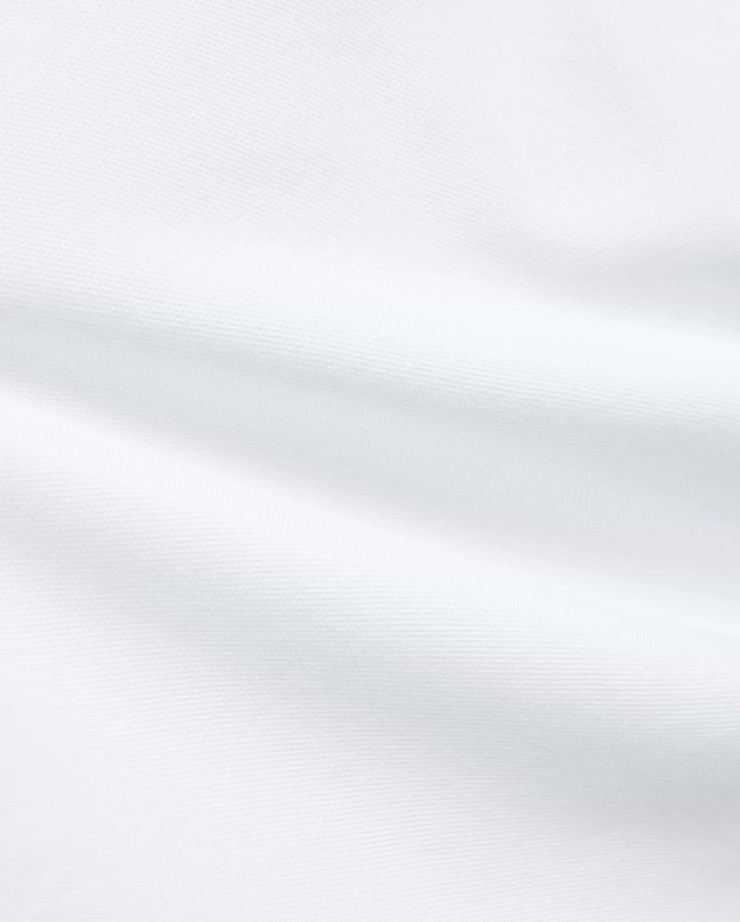 Premium White Kids Jaydon Pique Polo fabric, a detailed close-up revealing the refined, textured pique weave and elegant, subtle folds, reflecting the brand's quality.