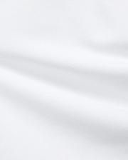 Premium White Kids Jaydon Pique Polo fabric, a detailed close-up revealing the refined, textured pique weave and elegant, subtle folds, reflecting the brand's quality.