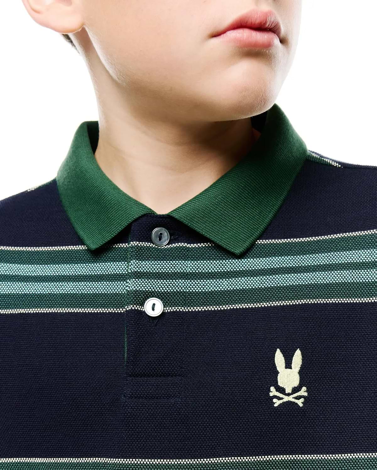 Kids Drew Striped L/S Pique Polo, a navy blue classic fit pique polo with a dark green ribbed collar, featuring horizontal stripes in green, light blue, and white, and a small embroidered white Psycho Bunny skull logo on the left chest.