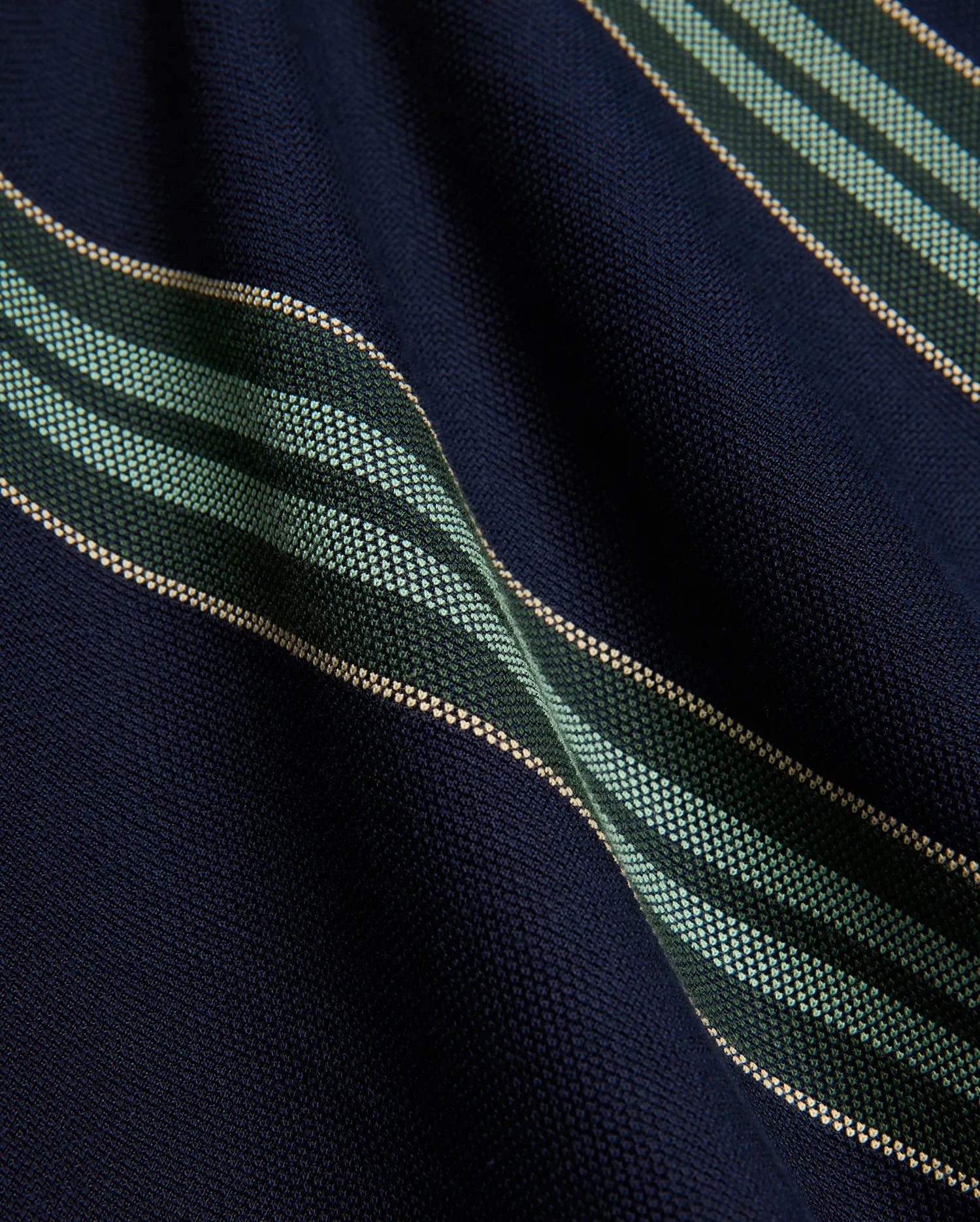 Kids Drew Striped L/S Pique Polo in navy, featuring a textured pique knit fabric with bold horizontal stripes in dark green, mint green, and thin beige accents.