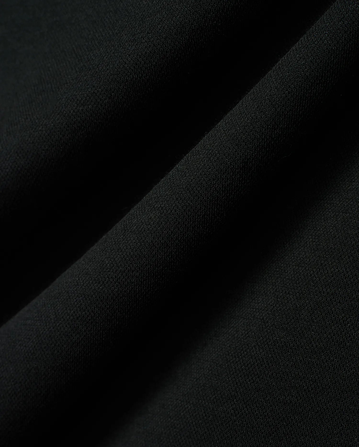 Kids Timmy Pique Polo in classic black, featuring a premium, finely textured pique knit fabric with soft, flowing folds, embodying Psycho Bunny's signature style. (6)