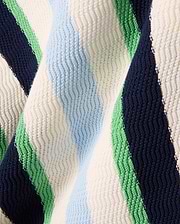 Kids Wren Stripe Knit Polo featuring bold navy, white, light blue, and green vertical stripes in a textured knit fabric with a subtle zig-zag pattern.