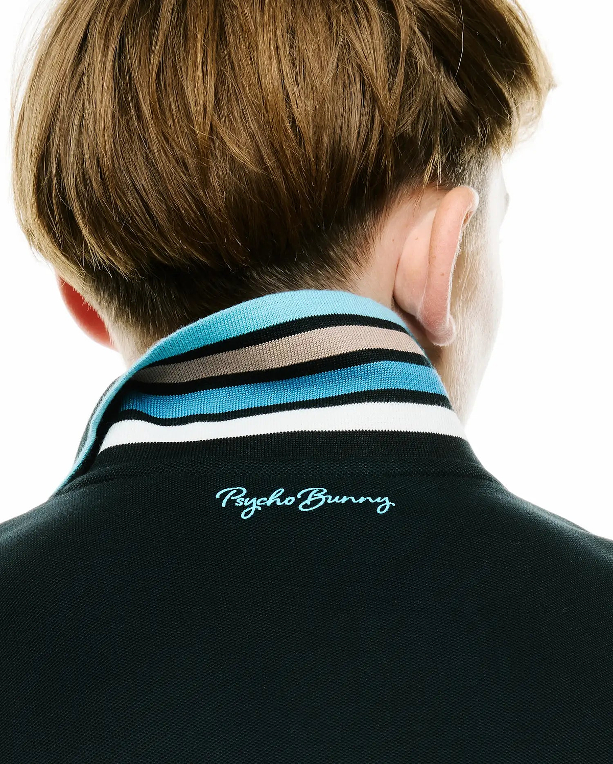 Kids' Klaus Pique Polo in black with a classic fit, featuring a striped collar in light blue, dark blue, tan, and white, and an embroidered Psycho Bunny script logo in light blue on the back neck. (3)