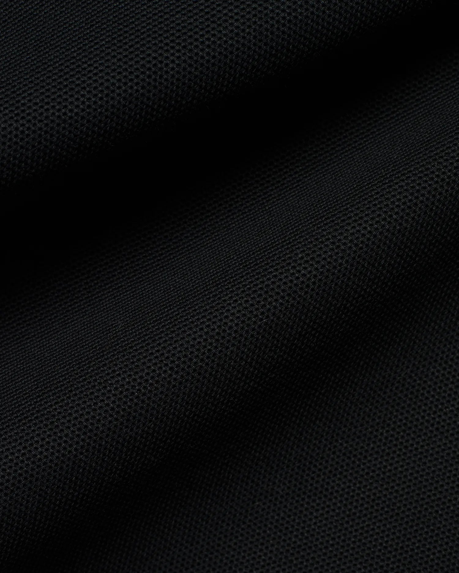 Kids' Klaus Pique Polo in classic black, showcasing the refined, breathable pique fabric texture, characteristic of premium Psycho Bunny streetwear, designed for comfort and style. (6)