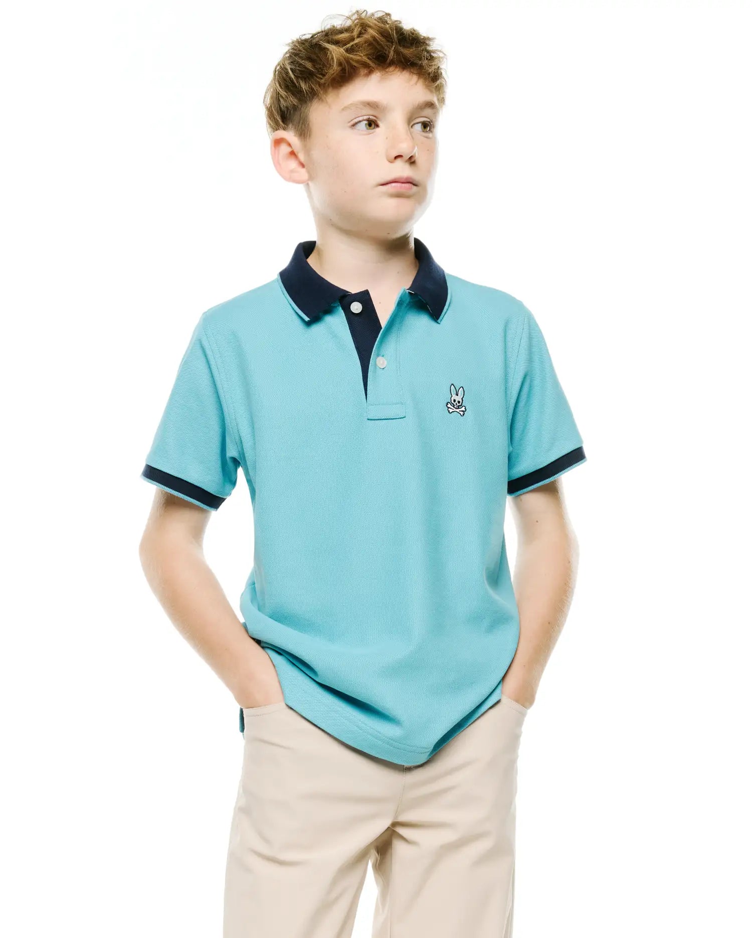 Kids' Klaus Pique Polo, aqua pique knit, classic fit, with navy collar and sleeve cuffs, featuring a small embroidered Psycho Bunny skull logo on the left chest. (1)