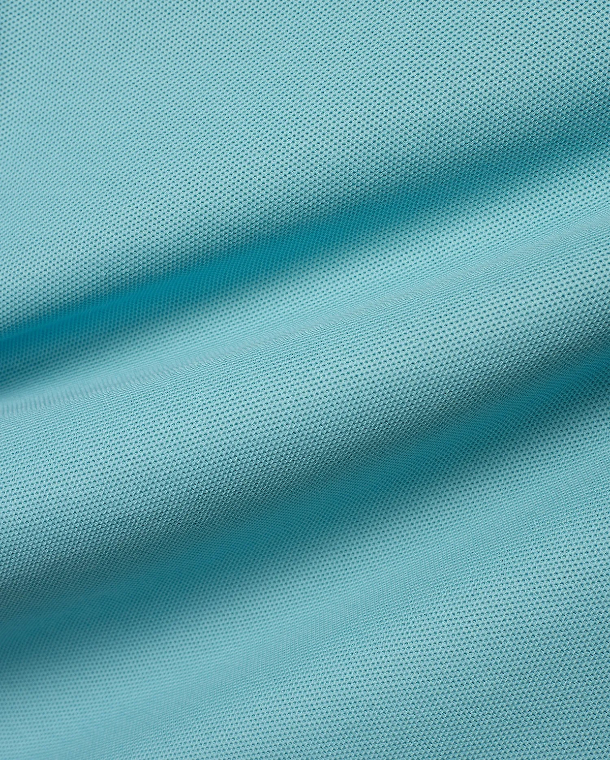 Kids' Klaus Pique Polo fabric in a vibrant aqua hue, featuring its signature textured pique weave with gentle ripples, reflecting premium Psycho Bunny quality. (6)