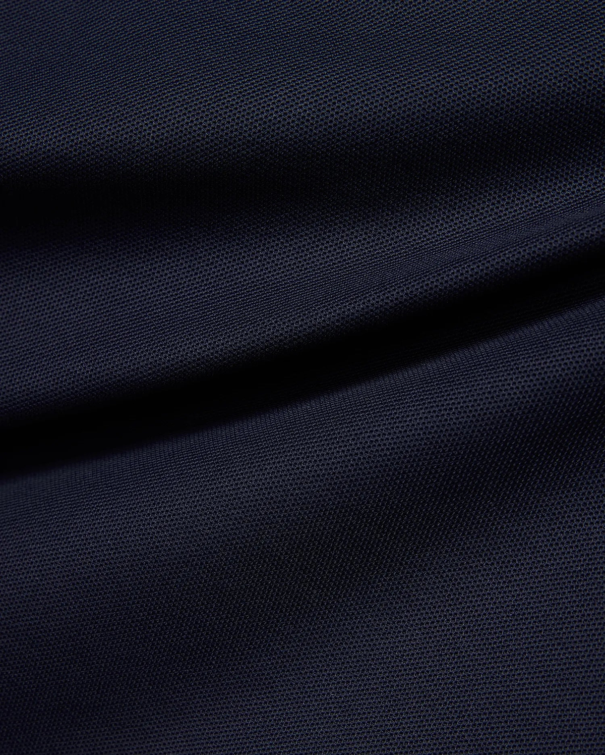 Kids' Grover Pique Longsleeve Polo in deep navy blue, showcasing the classic textured pique knit fabric with subtle draping, ideal for comfortable, stylish wear. (6)
