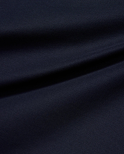 Kids' Grover Pique Longsleeve Polo in deep navy blue, showcasing the classic textured pique knit fabric with subtle draping, ideal for comfortable, stylish wear. (6)
