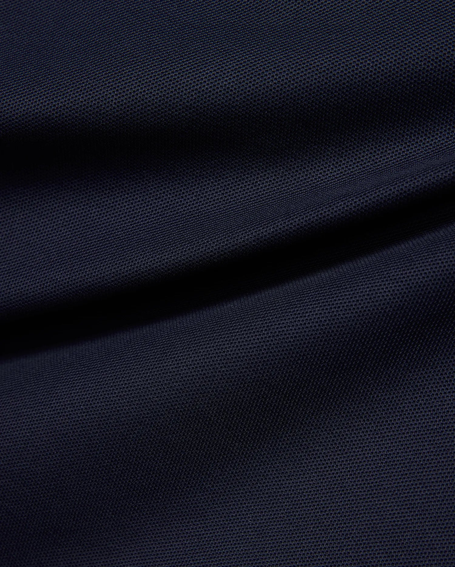 Kids' Grover Pique Longsleeve Polo in deep navy blue, showcasing the classic textured pique knit fabric with subtle draping, ideal for comfortable, stylish wear. (6)
