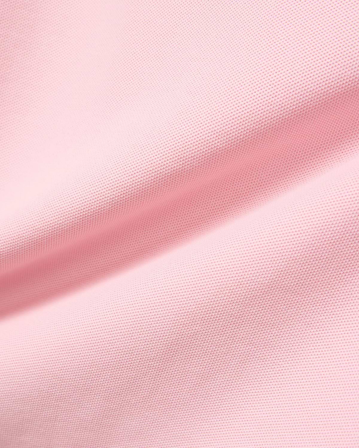 Kids Robin Pique Polo in vibrant pink, crafted from breathable pique fabric, featuring the signature embroidered Psycho Bunny skull logo on the chest, embodying refined streetwear style.