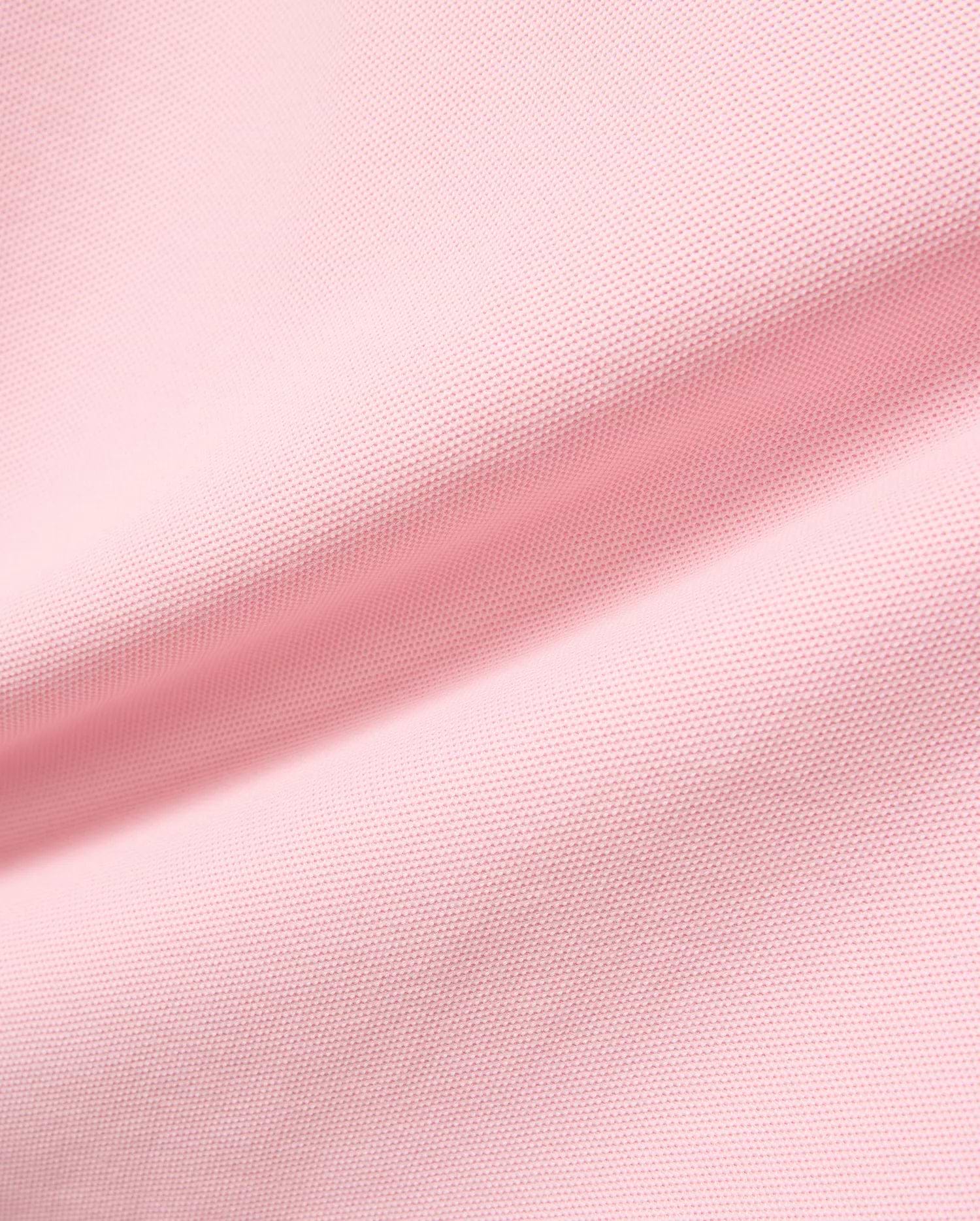 Kids Robin Pique Polo in vibrant pink, crafted from breathable pique fabric, featuring the signature embroidered Psycho Bunny skull logo on the chest, embodying refined streetwear style.