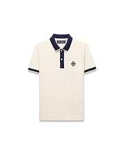 Kids Robin Pique Polo in cream pique fabric with a navy blue collar, placket, and sleeve cuffs, featuring a classic fit and an embroidered Psycho Bunny skull logo on the left chest.