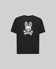 The Psycho Bunny KIDS RYDER OVERSIZED FIT TEE (KT0200056) is a black premium tee crafted from soft Pima cotton, featuring a white embroidered Bunny skull with bunny ears above crossed bones against a gray background.