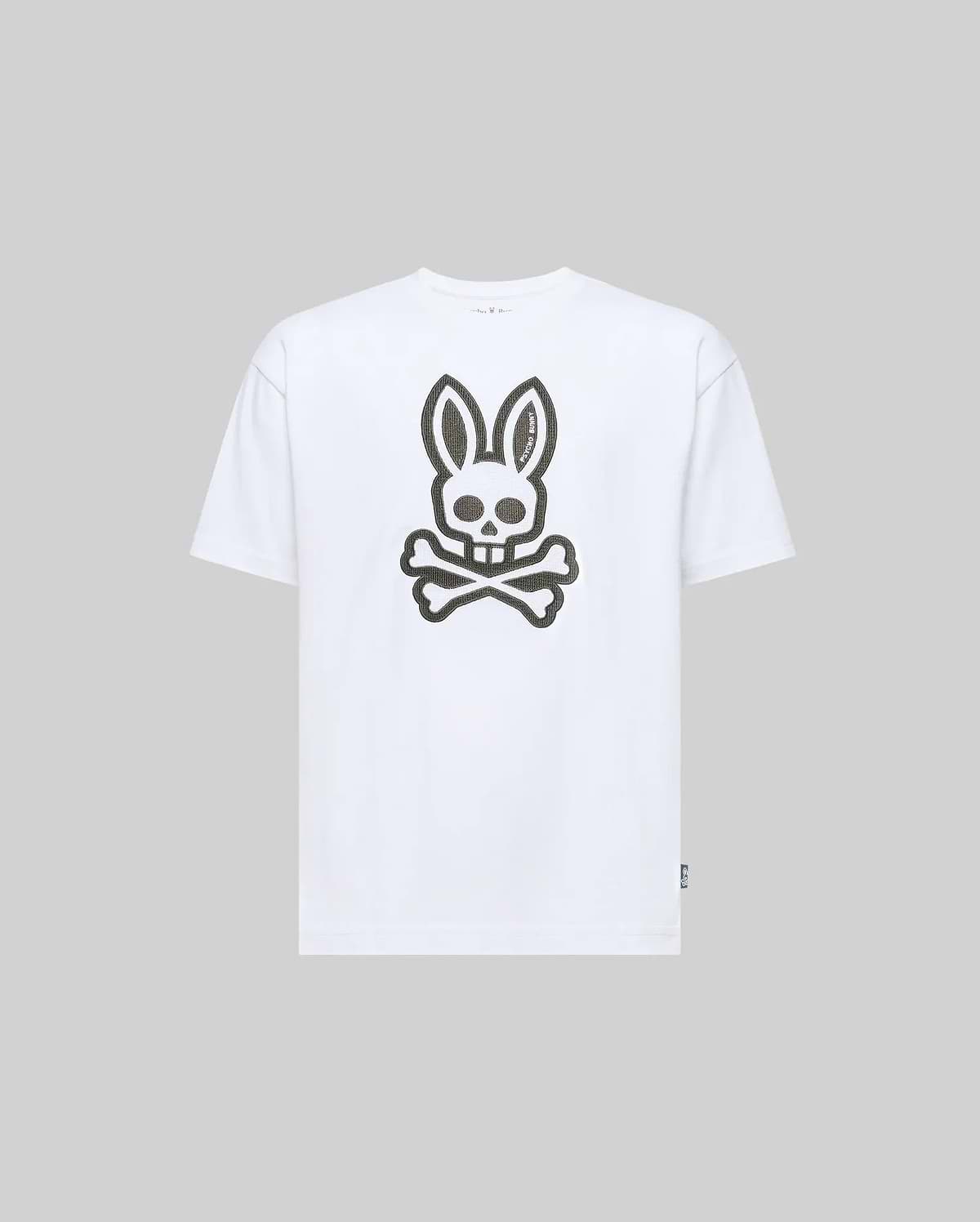 The KIDS RYDER OVERSIZED FIT TEE (KT0200056) by Psycho Bunny features a large stylized rabbit skull and crossbones graphic on the front, set against a light gray Pima cotton for premium softness.