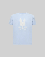 The Psycho Bunny KIDS GRANT BUNNY GRAPHIC TEE (KT0200061) is a light blue Pima cotton tee featuring an HD-printed white bunny head above crossed bones on the chest, shown on a plain gray background. (1)