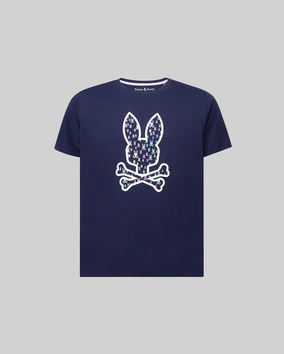 Kids Nev Bunny Graphic Tee. Navy classic fit jersey t-shirt featuring a large iridescent Psycho Bunny skull graphic on the front, filled with smaller multi-color bunny logos, and a small embroidered logo on the left chest. (1)