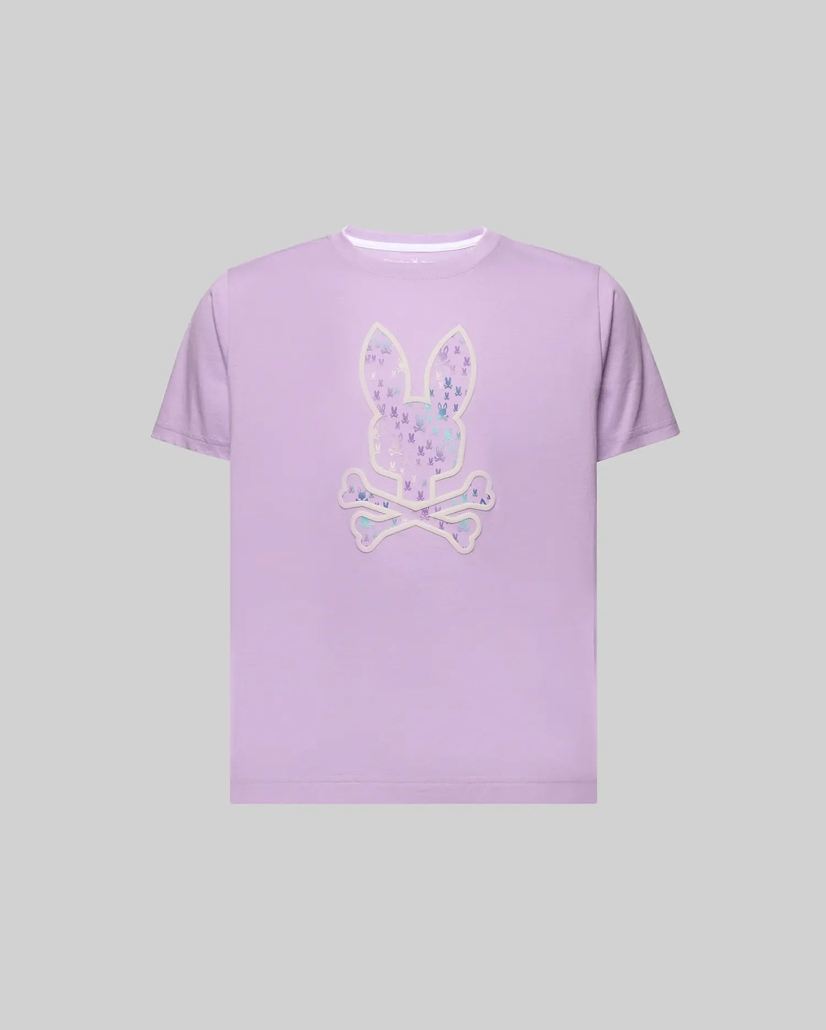Kids Nev Bunny Graphic Tee in lavender, a classic fit, smooth jersey knit shirt featuring a large central Psycho Bunny skull logo graphic with a white outline, filled with a vibrant, multi-color pattern of smaller bunny skulls. (1)