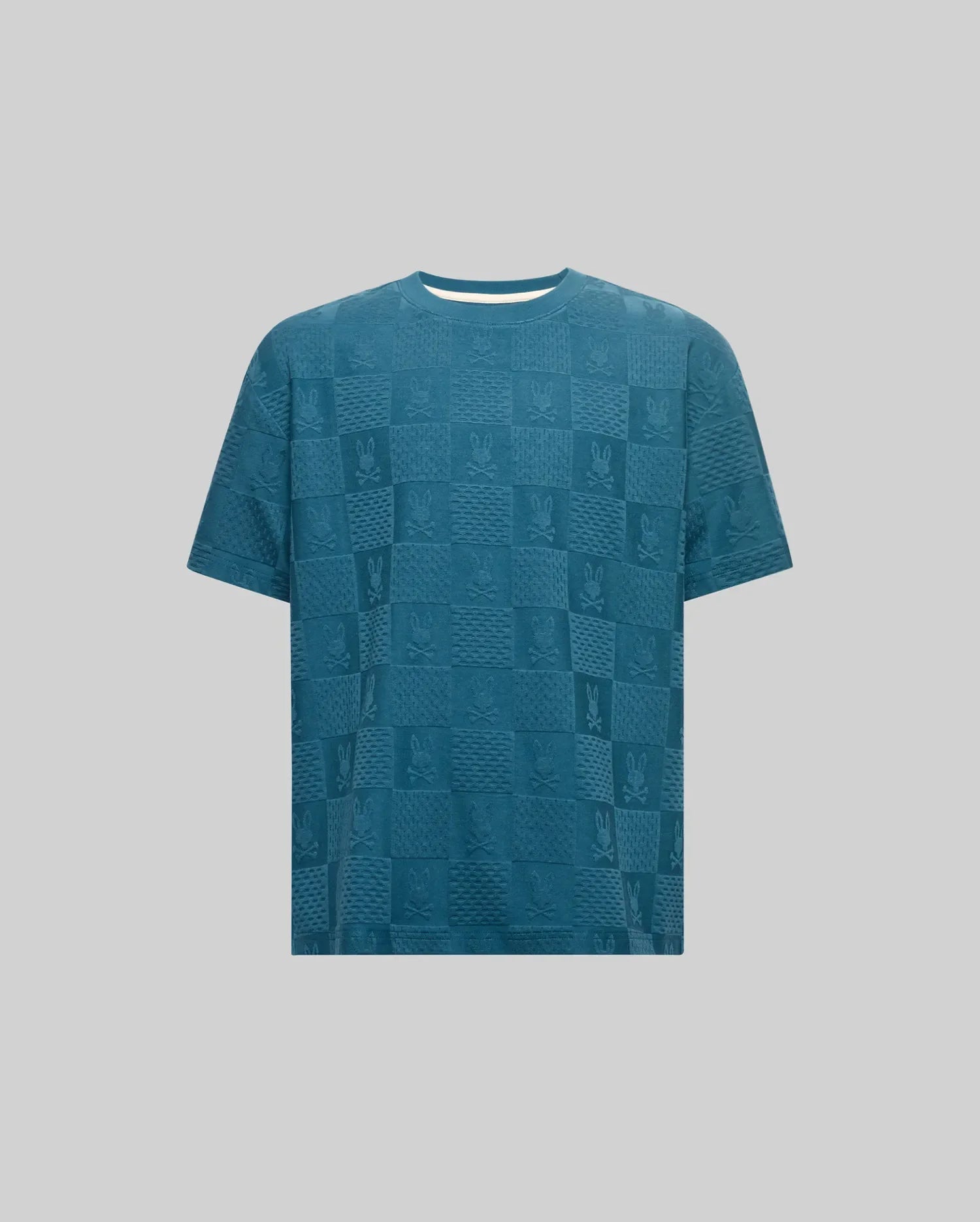 Kids Dustin Oversized Tee in teal blue, a relaxed fit textured knit featuring an all-over checkerboard pattern with embossed Psycho Bunny skull logos.