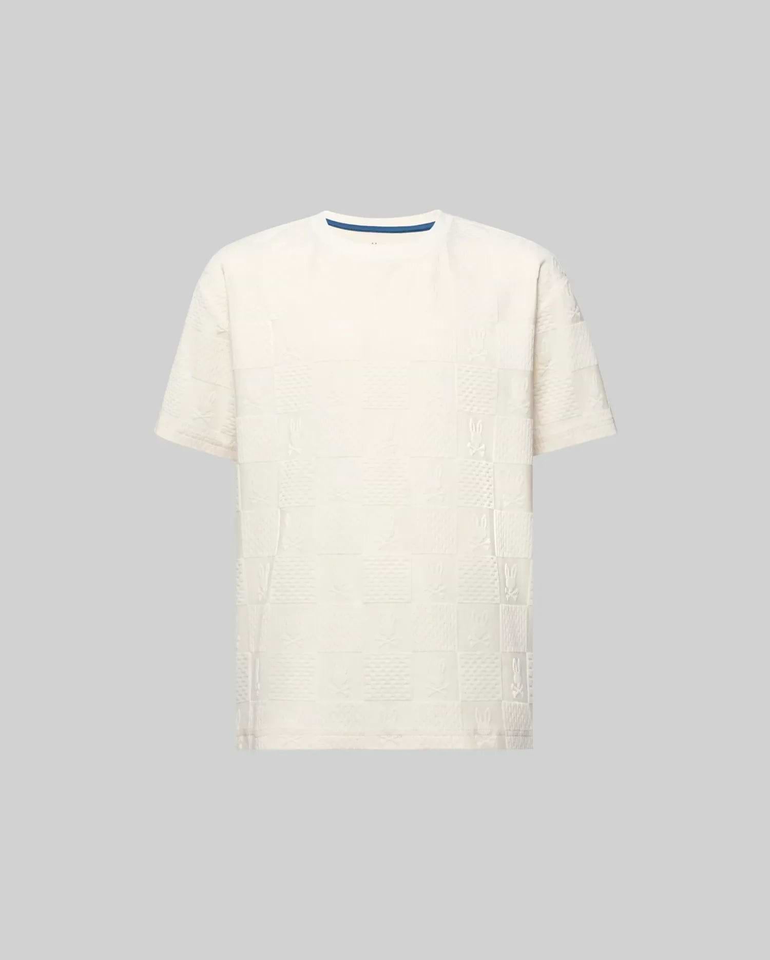 Kids Dustin Oversized Tee in cream, featuring an all-over textured checkerboard pattern with embossed Psycho Bunny skull logos and a subtle blue inner collar trim.