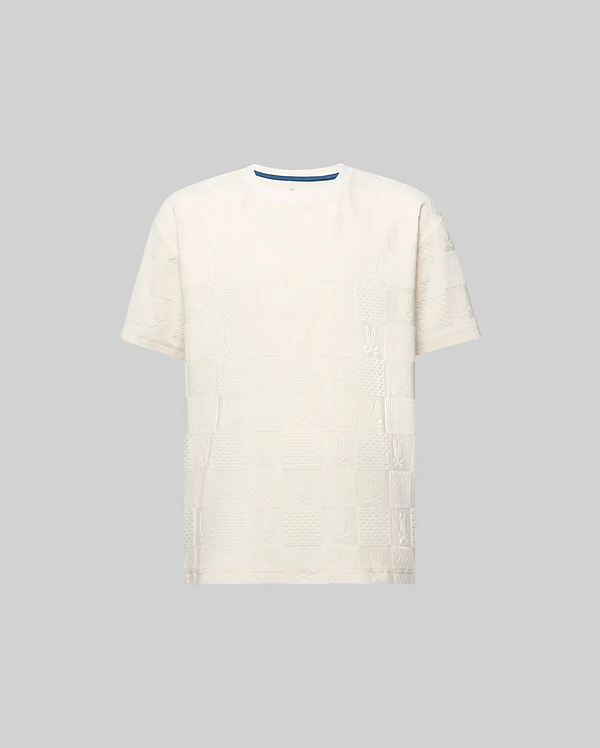 Kids Dustin Oversized Tee in cream, featuring an all-over textured checkerboard pattern with embossed Psycho Bunny skull logos and a subtle blue inner collar trim.