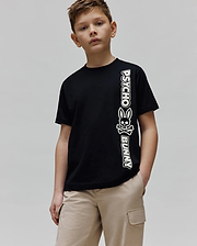 Kids Toby Wordmark Tee, a black classic fit jersey knit t-shirt featuring a large vertical white Psycho Bunny wordmark and iconic bunny skull logo graphic on the left side.