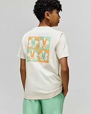 Kids Aiden Back Graphic Tee, a cream classic fit jersey t-shirt with a large back graphic featuring a checkerboard of orange and mint green Psycho Bunny skull logos.