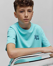 Kids Luke Back Graphic Tee in aqua smooth jersey, featuring a classic fit and a small, dark blue embroidered Psycho Bunny skull logo on the left chest.