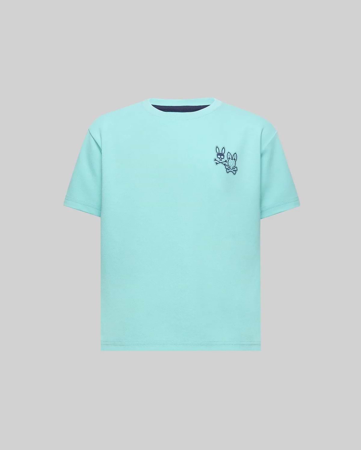 Kids Luke Back Graphic Tee, an aqua classic fit jersey with a navy crew neck trim and a small navy Psycho Bunny skull and crossbones graphic alongside another bunny on the left chest.