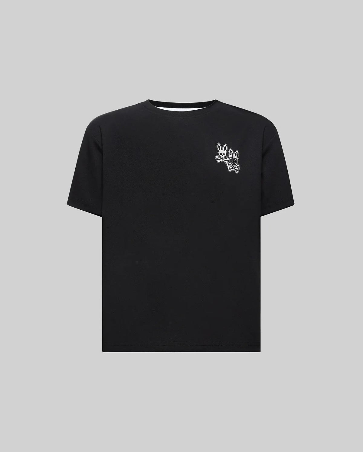 Kids Luke Back Graphic Tee, a black jersey t-shirt with a classic fit, featuring a small white double Psycho Bunny skull and crossbones graphic on the upper left chest.