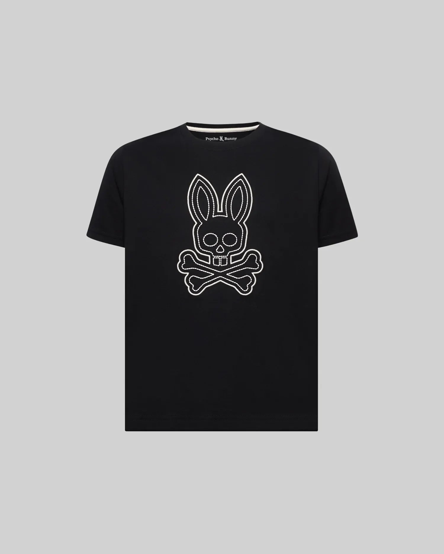 Kids Marcel Graphic Tee, black classic fit jersey tee with a large white outline bunny skull graphic on the chest and a small Psycho Bunny logo on the inner neck.