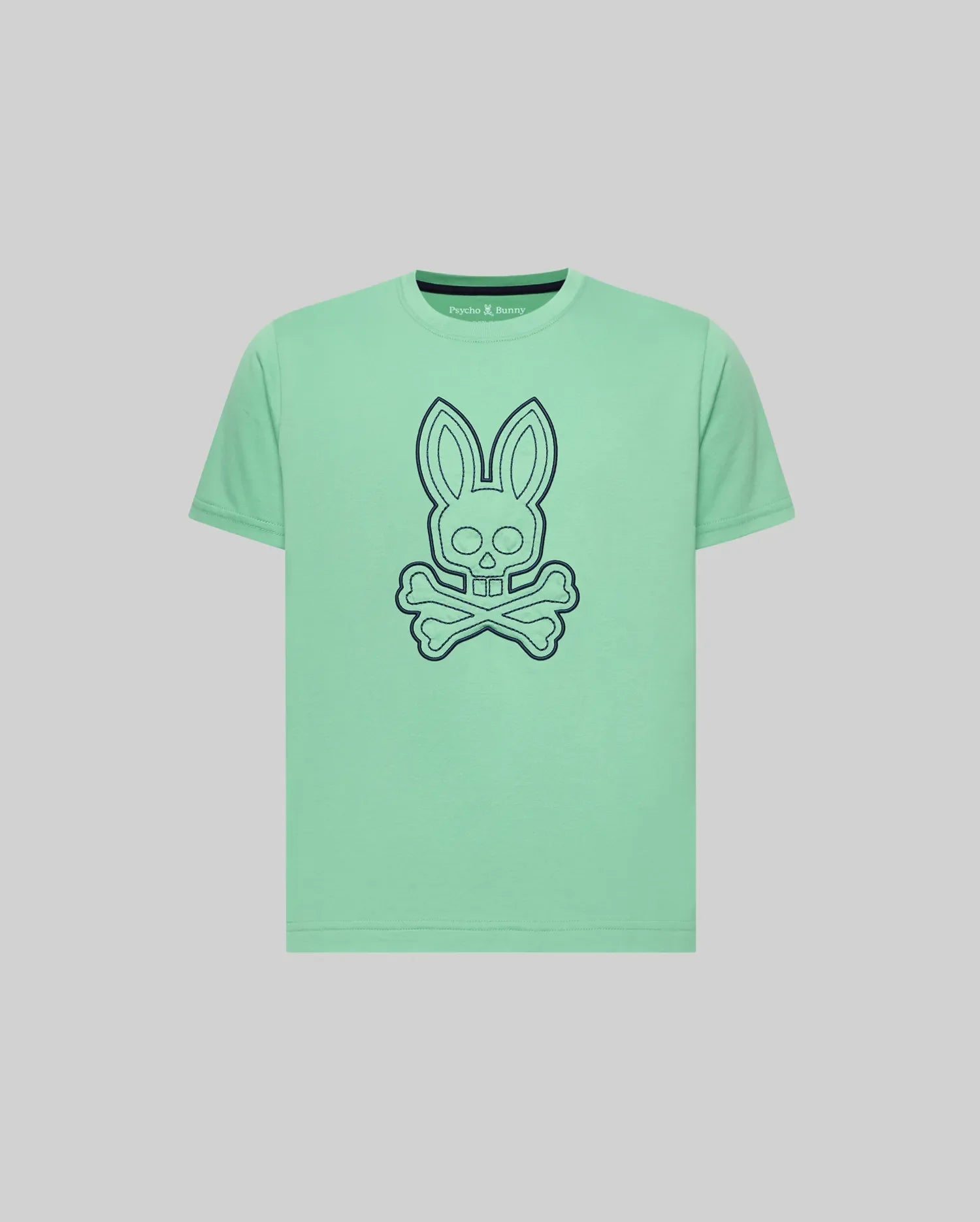Kids Marcel Graphic Tee in mint green jersey, featuring a large dark blue outline bunny skull and crossbones graphic on the chest, small embroidered Psycho Bunny text logo on upper left, classic fit. (1)