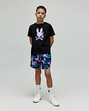 Kids Van Graphic Tee, a black jersey t-shirt with a large purple textured bunny skull chest graphic, paired with relaxed teal, purple, blue patchwork shorts featuring small bunny skull logos. (4)
