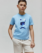 Kids Ara Graphic Tee in sky blue jersey knit, featuring a large central Psycho Bunny skull and crossbones logo with a multi-tonal blue camouflage pattern, classic fit.