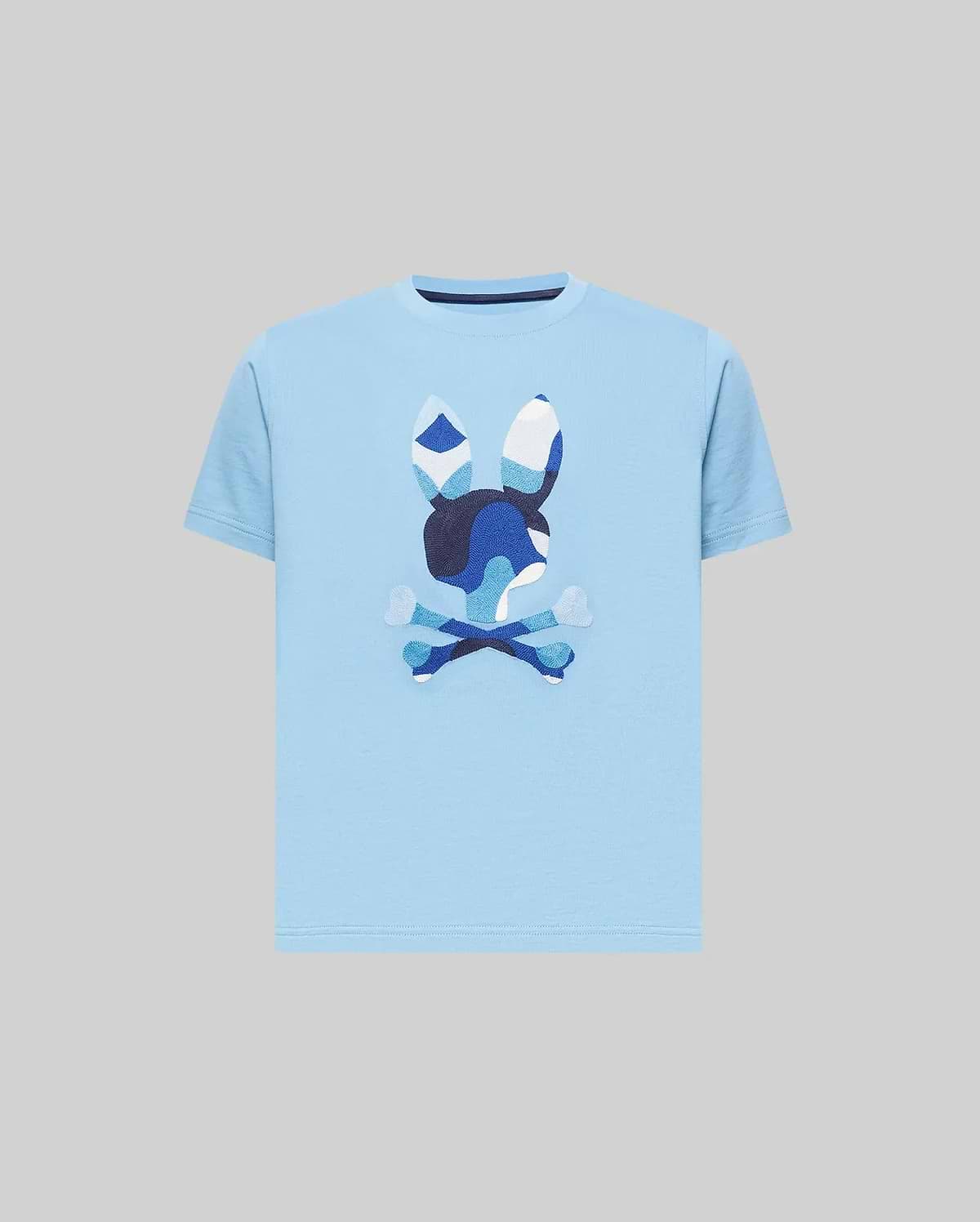 Kids Ara Graphic Tee, a classic fit sky blue jersey knit t-shirt featuring a large, center chest Psycho Bunny skull logo with a distinctive blue and white camouflage pattern.