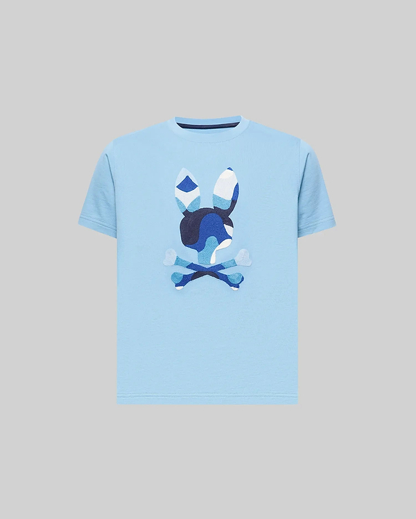 Kids Ara Graphic Tee, a classic fit sky blue jersey knit t-shirt featuring a large, center chest Psycho Bunny skull logo with a distinctive blue and white camouflage pattern.
