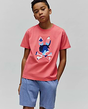 Coral Pink Kids Ara Graphic Tee in classic fit jersey, featuring a large, vibrant blue and white patterned Psycho Bunny skull logo on the center chest.
