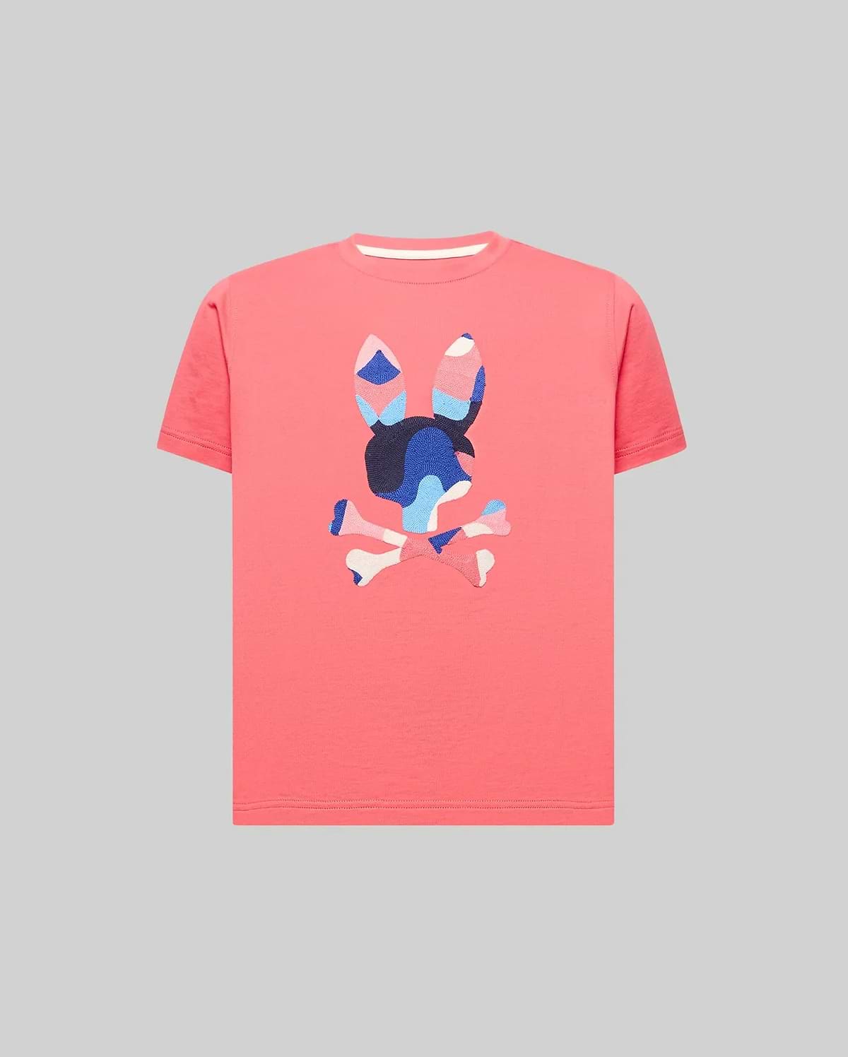 Kids Ara Graphic Tee in vibrant coral, crafted from soft jersey knit with a classic fit. Features a large, textured, multi-color camouflage Psycho Bunny skull logo prominently on the chest.