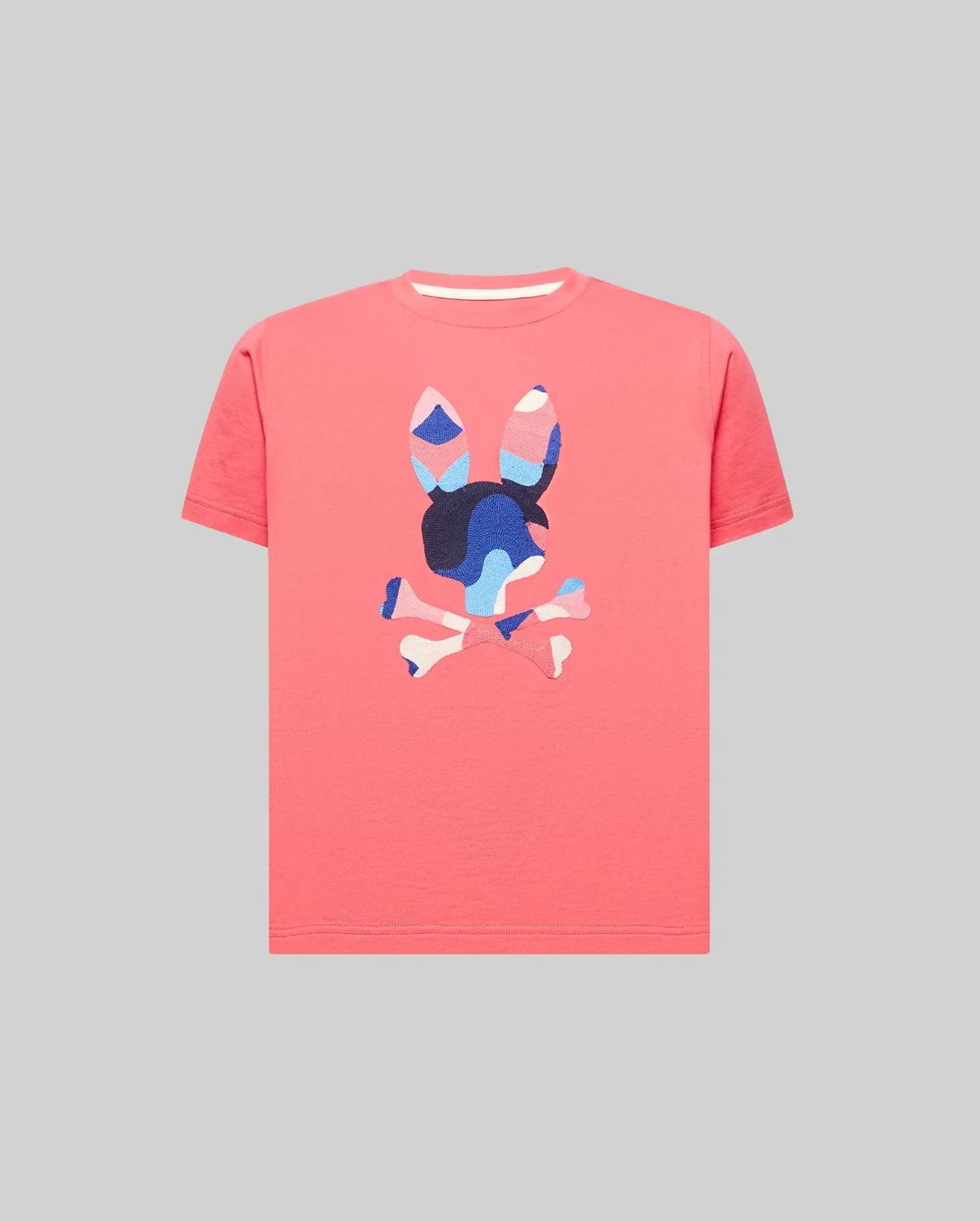 Kids Ara Graphic Tee in vibrant coral, crafted from soft jersey knit with a classic fit. Features a large, textured, multi-color camouflage Psycho Bunny skull logo prominently on the chest.