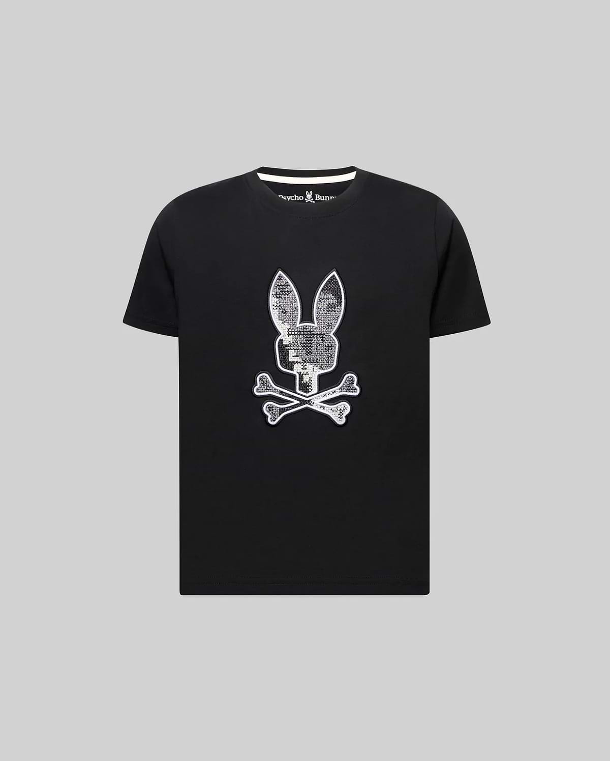 Kids Olivier Graphic Tee, a black classic fit jersey t-shirt featuring a large textured white and silver Psycho Bunny skull graphic on the chest and white collar trim. (1)