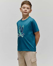 Kids Olivier Graphic Tee, a classic fit teal jersey t-shirt featuring a large chest graphic of the iconic Psycho Bunny skull logo with green and blue camouflage pattern and light blue bones, outlined in white. (2)