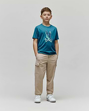 Kids Olivier Graphic Tee in teal jersey, featuring a large, textured blue and green Psycho Bunny skull and crossbones graphic on the chest, paired with relaxed fit khaki cargo pants. (4)