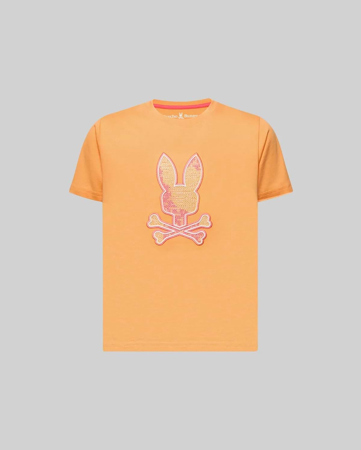 Kids Olivier Graphic Tee in orange jersey, featuring a large, glittery pink and white Psycho Bunny skull graphic on the chest and a pink inner neck tape. (1)