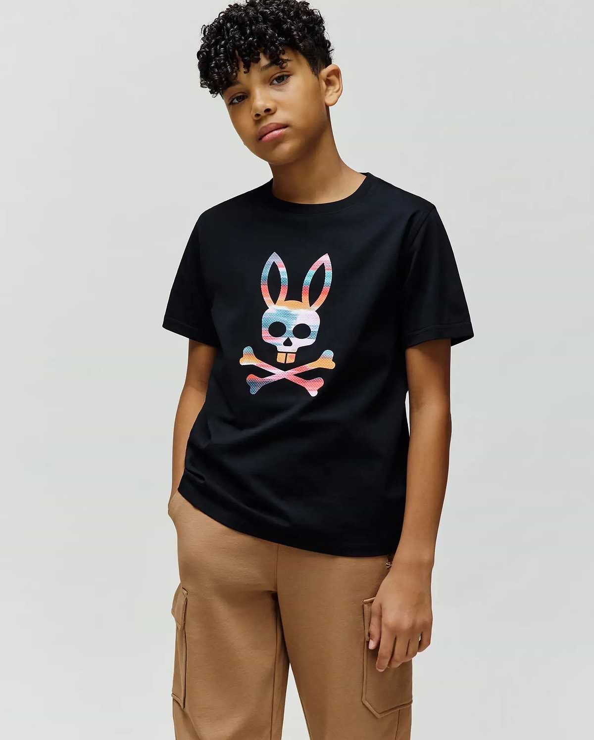 Kids Raphael Graphic Tee in black, featuring a large, vibrant multicolor striped Psycho Bunny skull and crossbones graphic centered on the chest, in a classic fit smooth jersey knit. (4)