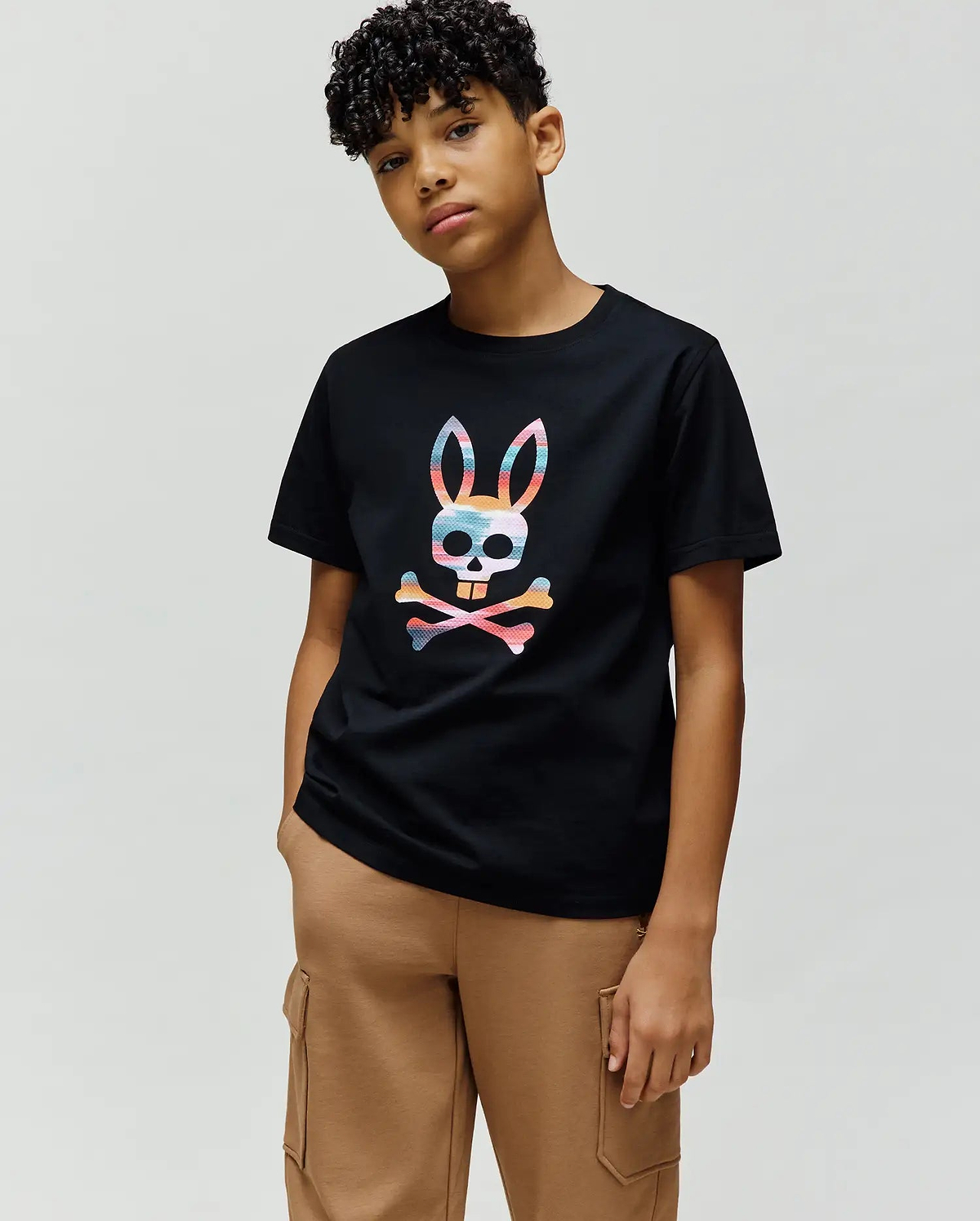 Kids Raphael Graphic Tee in black, featuring a large, vibrant multicolor striped Psycho Bunny skull and crossbones graphic centered on the chest, in a classic fit smooth jersey knit. (4)