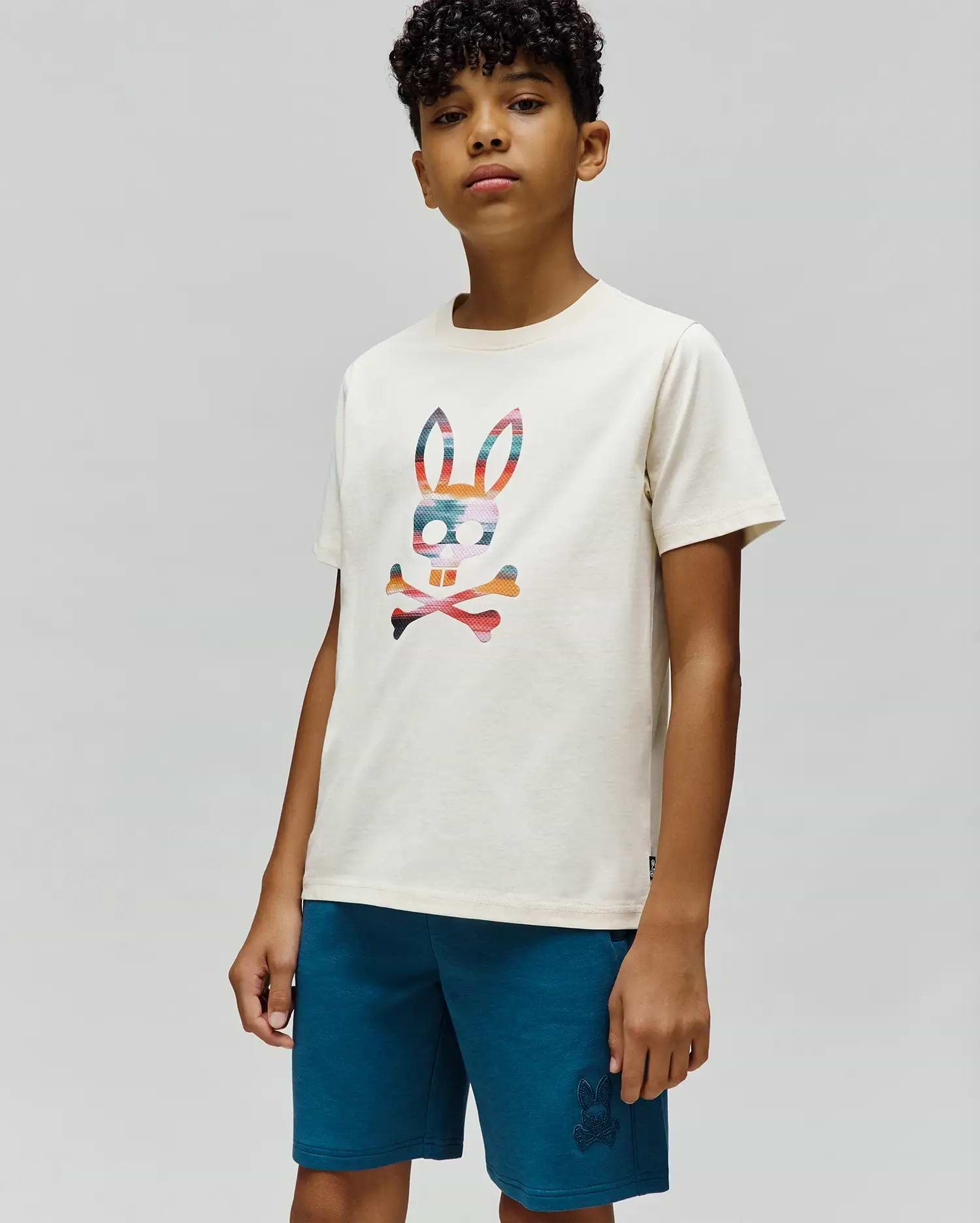 Kids Raphael Graphic Tee, an ecru jersey knit with a classic fit, showcasing a large, vibrant multi-color striped Psycho Bunny skull graphic on the chest.