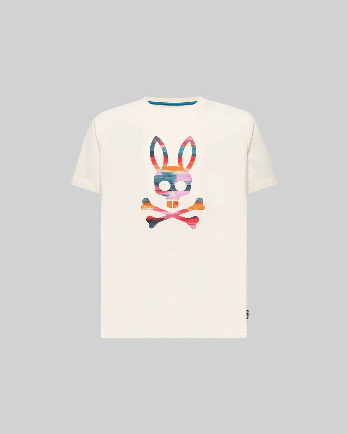 Kids Raphael Graphic Tee, a classic fit off-white jersey t-shirt featuring a large, vibrant multi-color striped Psycho Bunny skull graphic on the chest and a blue inner collar detail.