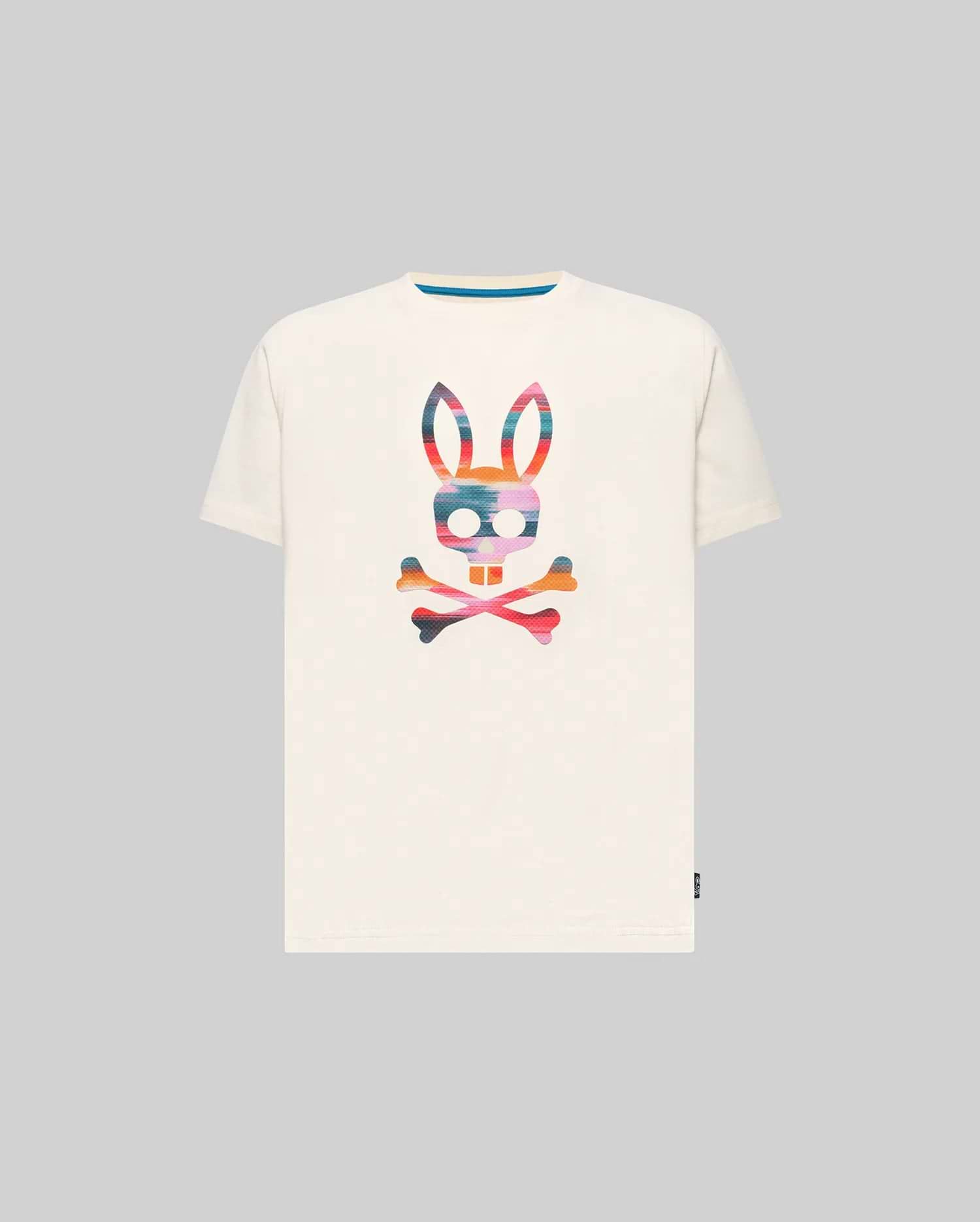 Kids Raphael Graphic Tee, a classic fit off-white jersey t-shirt featuring a large, vibrant multi-color striped Psycho Bunny skull graphic on the chest and a blue inner collar detail.