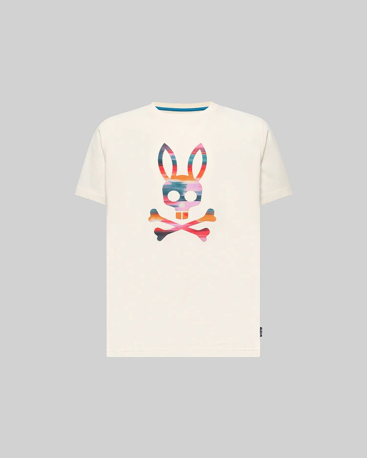 Kids Raphael Graphic Tee, a classic fit off-white jersey t-shirt featuring a large, vibrant multi-color striped Psycho Bunny skull graphic on the chest and a blue inner collar detail.